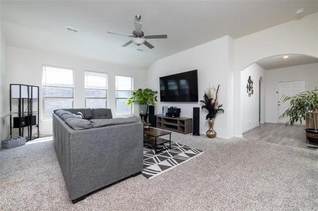 a view of a hallway with wooden floor and entryway