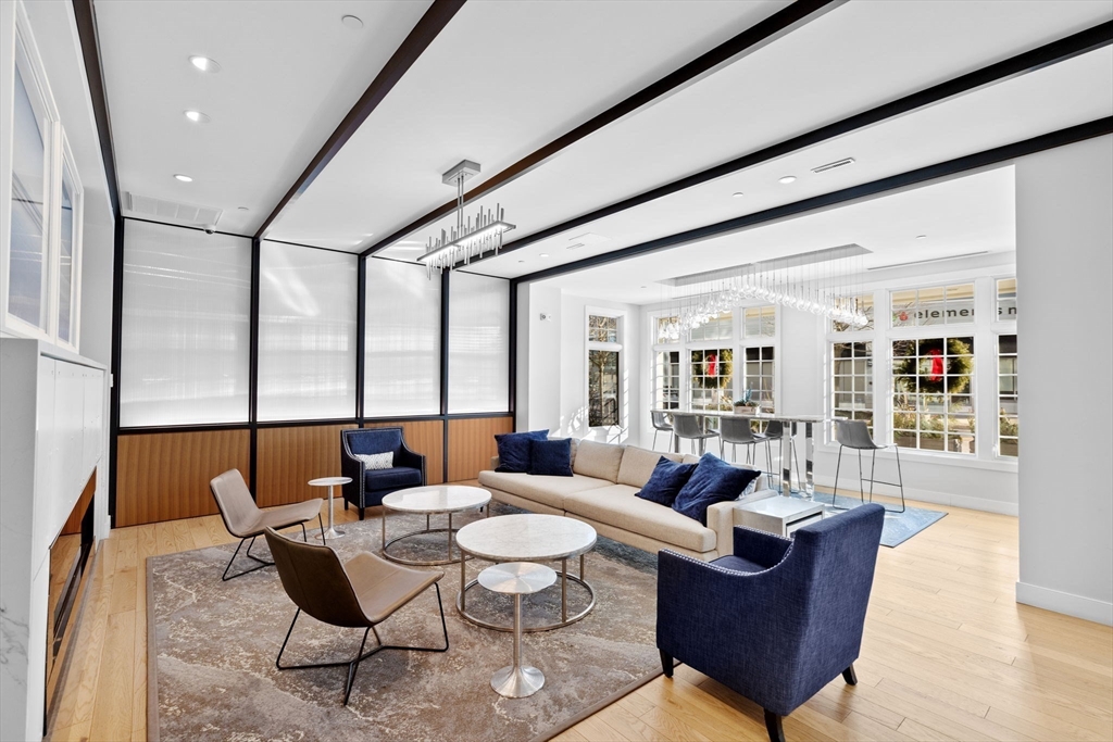 10 Shipyard Drive, Unit 215 Hingham, MA 02043 - Photo 3 of 18 a living room with furniture and a large window