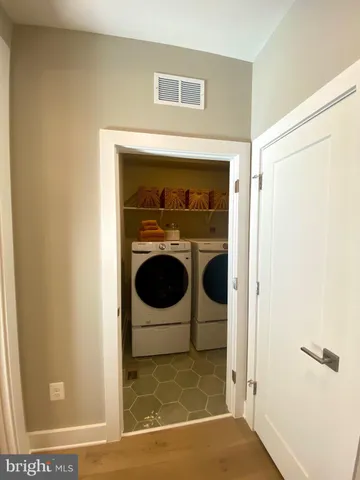 a living room with fireplace furniture and a flat screen tv