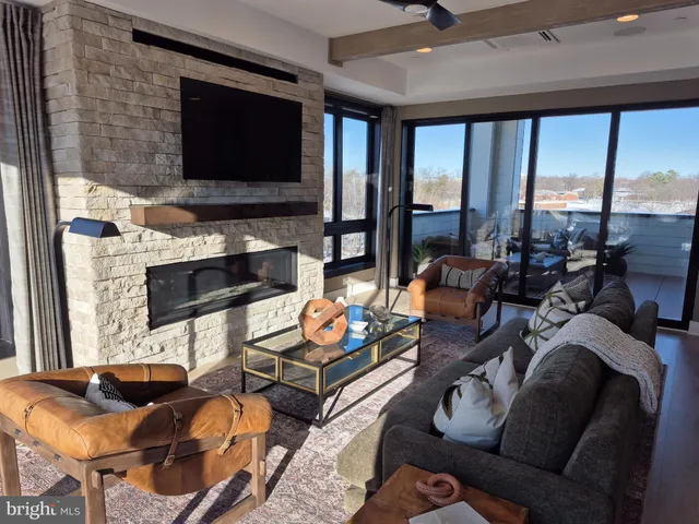 a living room with furniture or outdoor view and a large window