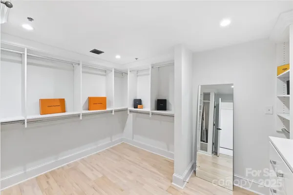 a bedroom with a bed lamps and window