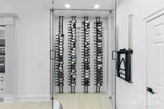 a dining room with furniture a wooden floor and chandelier