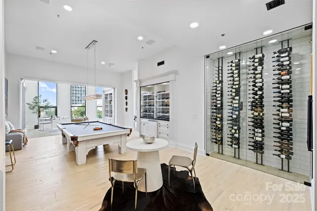 a view of a hallway with painting on the wall