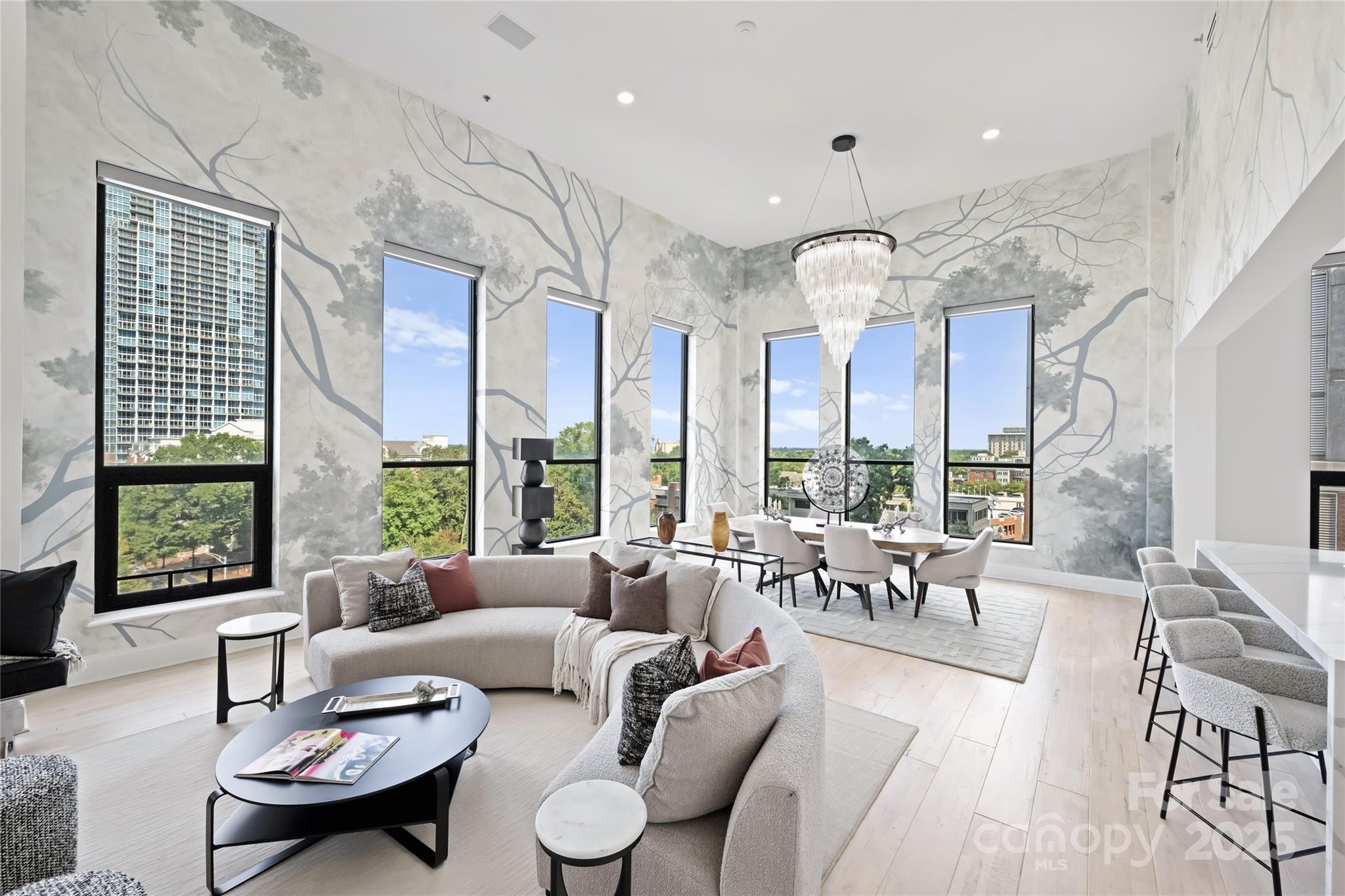 127 North Tryon Street, Unit 615 Charlotte, NC 28246 - Photo 3 of 48 a living room with furniture and a large window