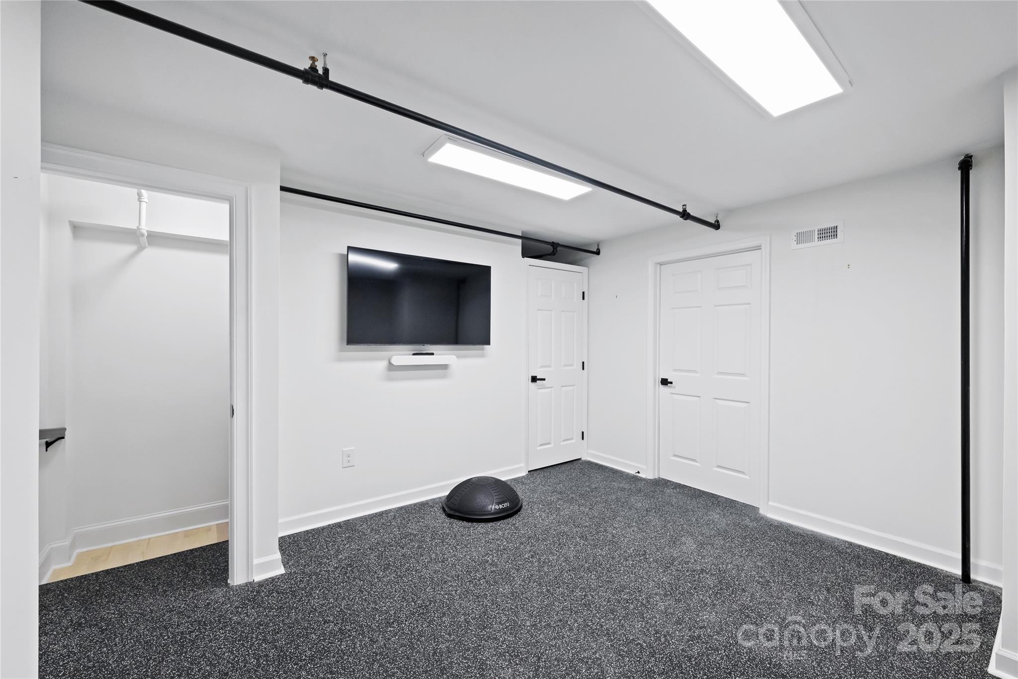 127 North Tryon Street, Unit 615 Charlotte, NC 28246 - Photo 36 of 48 a view of a livingroom with wooden floor