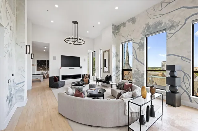 a living room with fireplace furniture and a flat screen tv