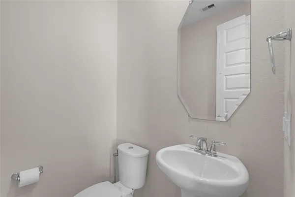a bathroom with a sink and cabinets