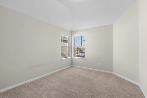 an empty room with closet area