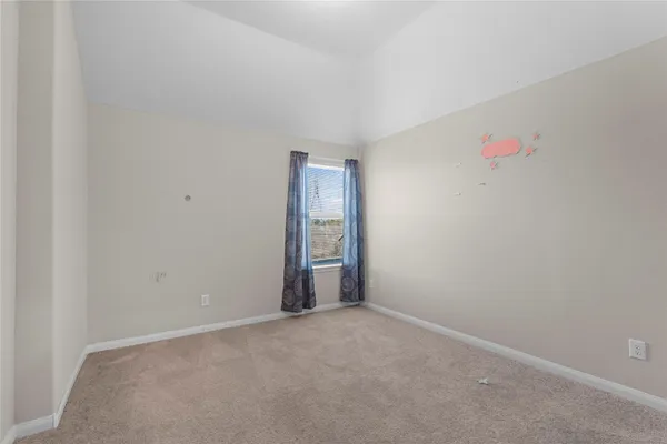 an empty room with closet area