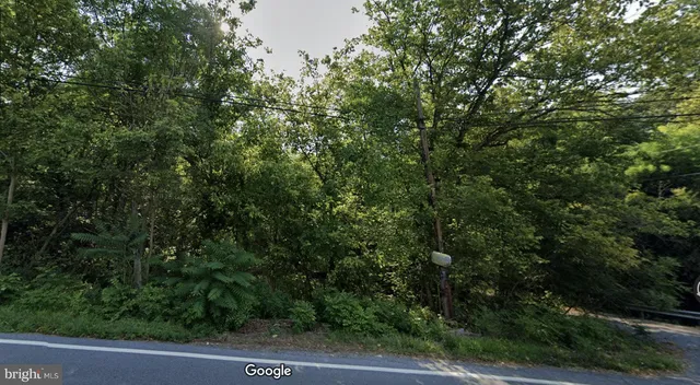 an outdoor view of house with green space