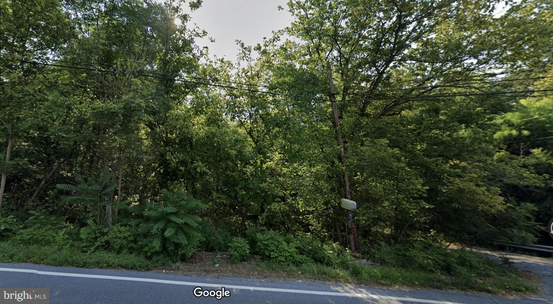 an outdoor view of house with green space
