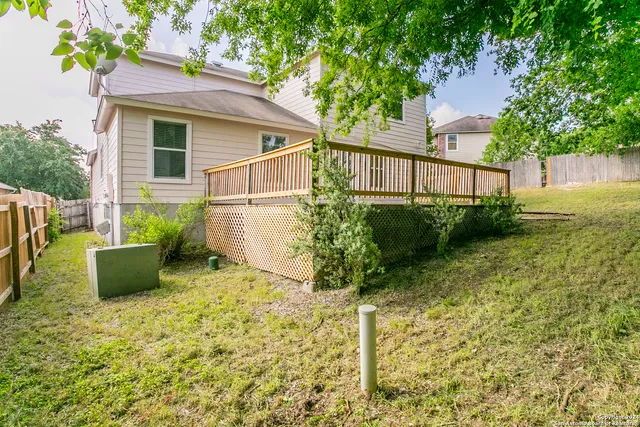 a backyard of a house with lots of green space