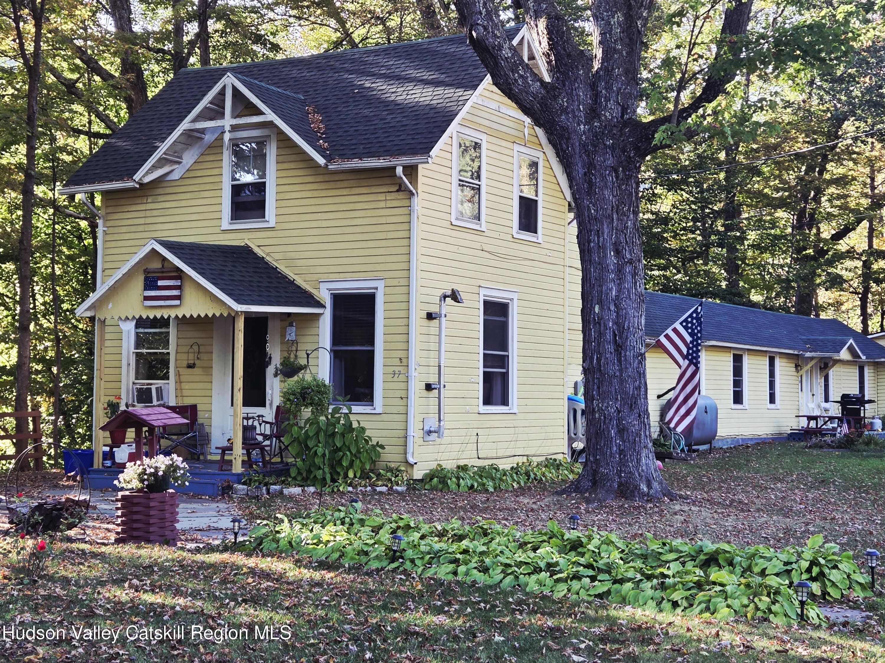 37-69 Mt Ava Maria Road Phoenicia, NY 12464 - Photo 2 of 27 a front view of a house with garden