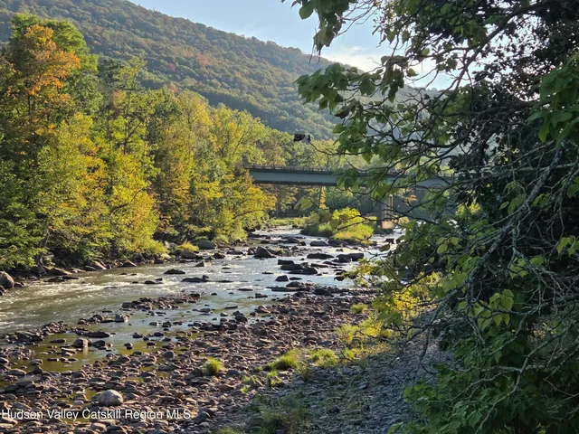 a view of a patio with a table and chairs
