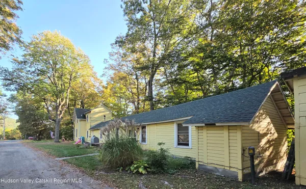 a view of a house with a tree
