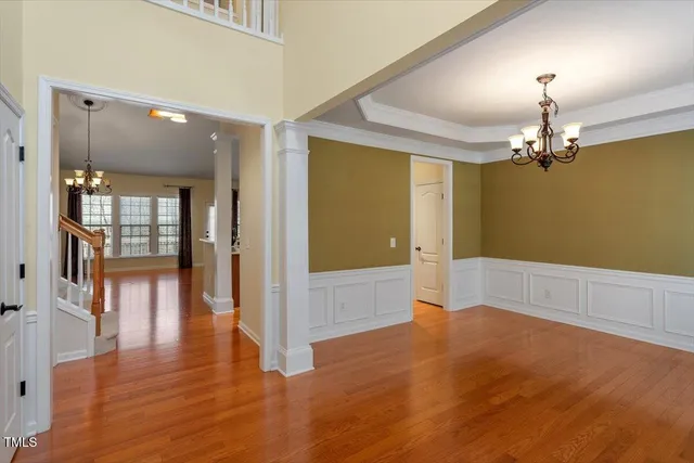 a view of livingroom with hardwood floor and kitchen view