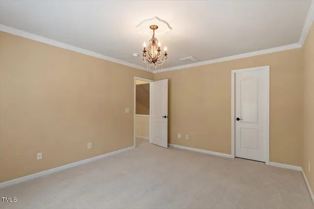 a view of a chandelier in big room and chandelier