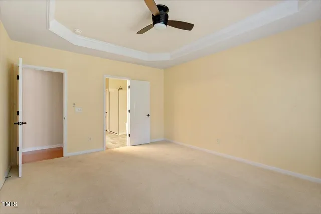 a view of an empty room and a window