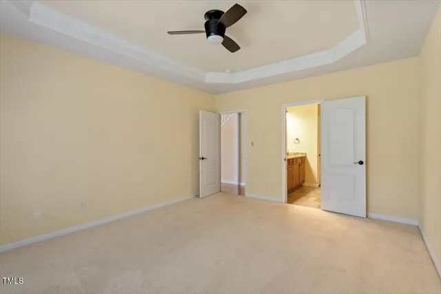 a view of empty room with ceiling fan