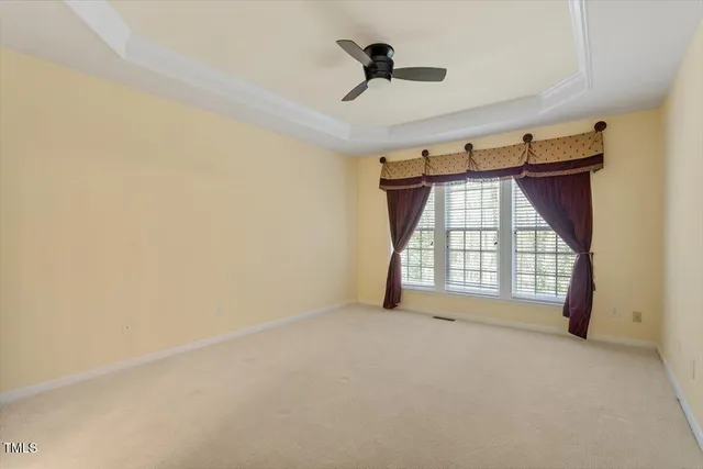 a view of empty room with windows