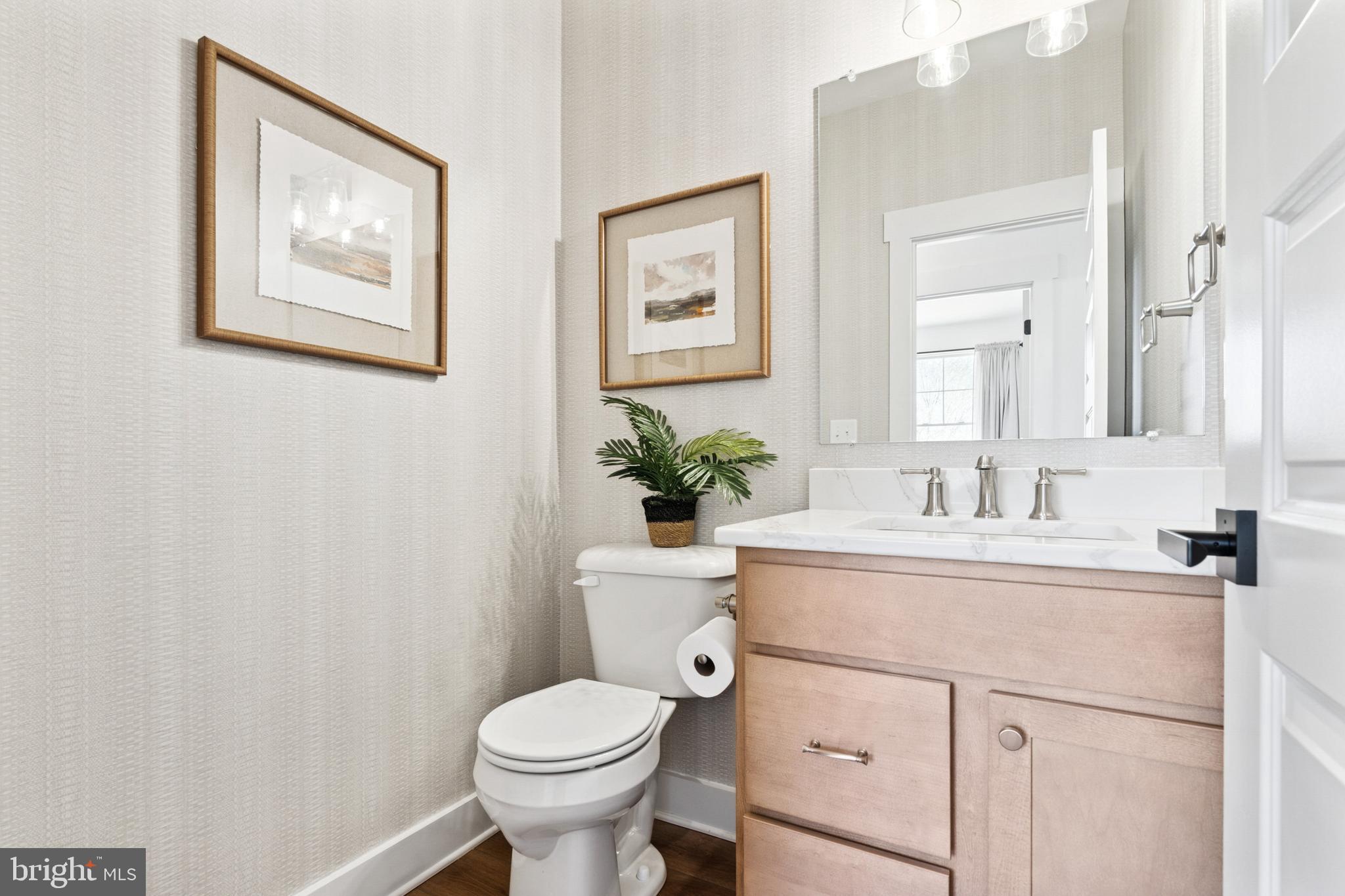 285 Ledger Drive, Unit 61 Hanover, PA 17331 - Photo 20 of 41 a bathroom with a toilet sink and mirror