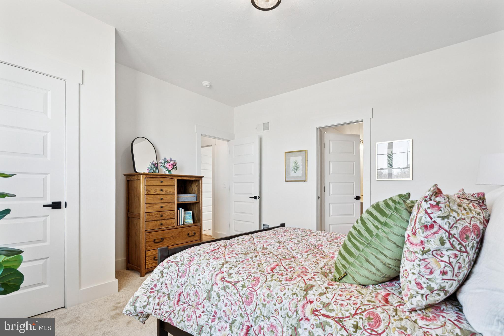285 Ledger Drive, Unit 61 Hanover, PA 17331 - Photo 22 of 41 a bedroom with a bed and a dresser
