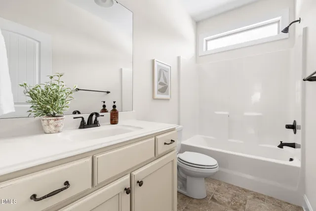 a bathroom with a sink a toilet and a bathtub