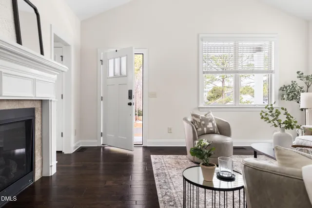 a living room with furniture rug and window