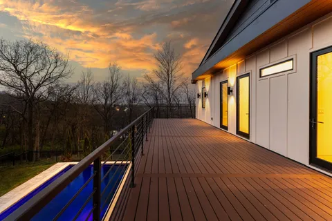 a view of balcony and trees