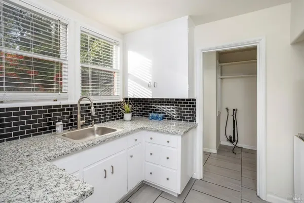 a kitchen with granite countertop a sink and a granite counter tops