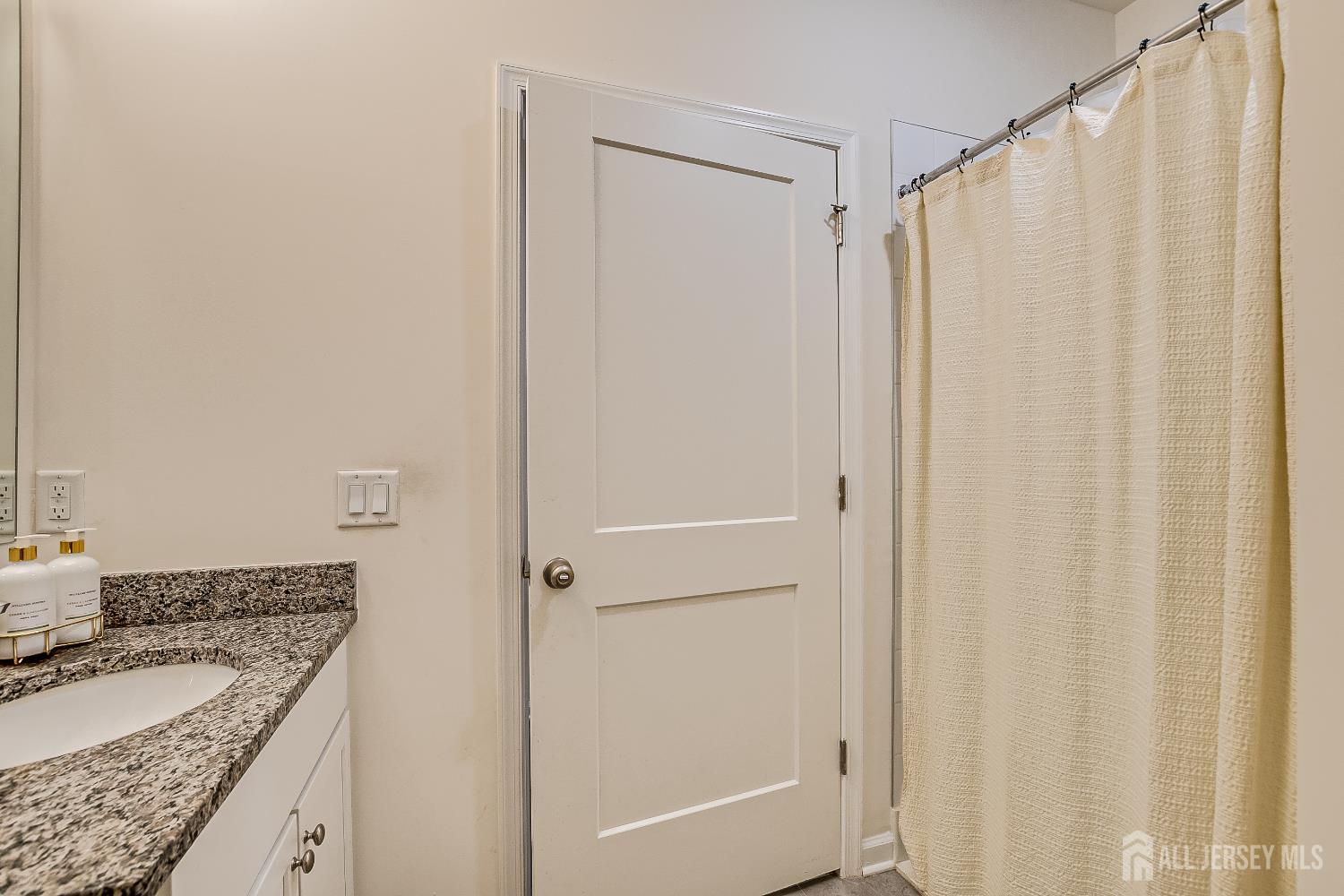 224 Park Lane Dunellen, NJ 08812 - Photo 20 of 40 a bathroom with a granite countertop sink and a mirror