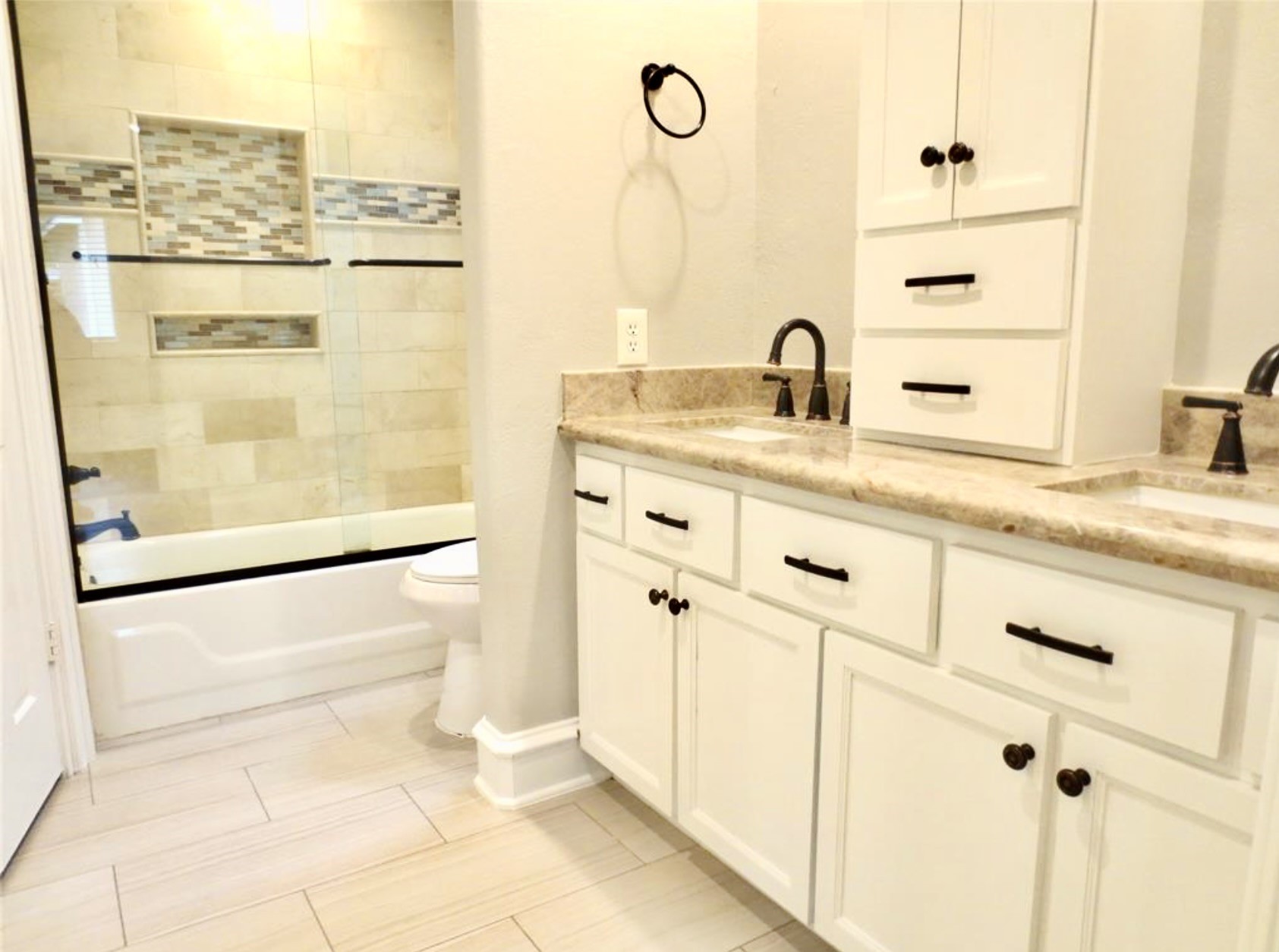 8214 Split Oak Drive Houston, TX 77040 - Photo 6 of 15 a bathroom with a double vanity sink a mirror and shower