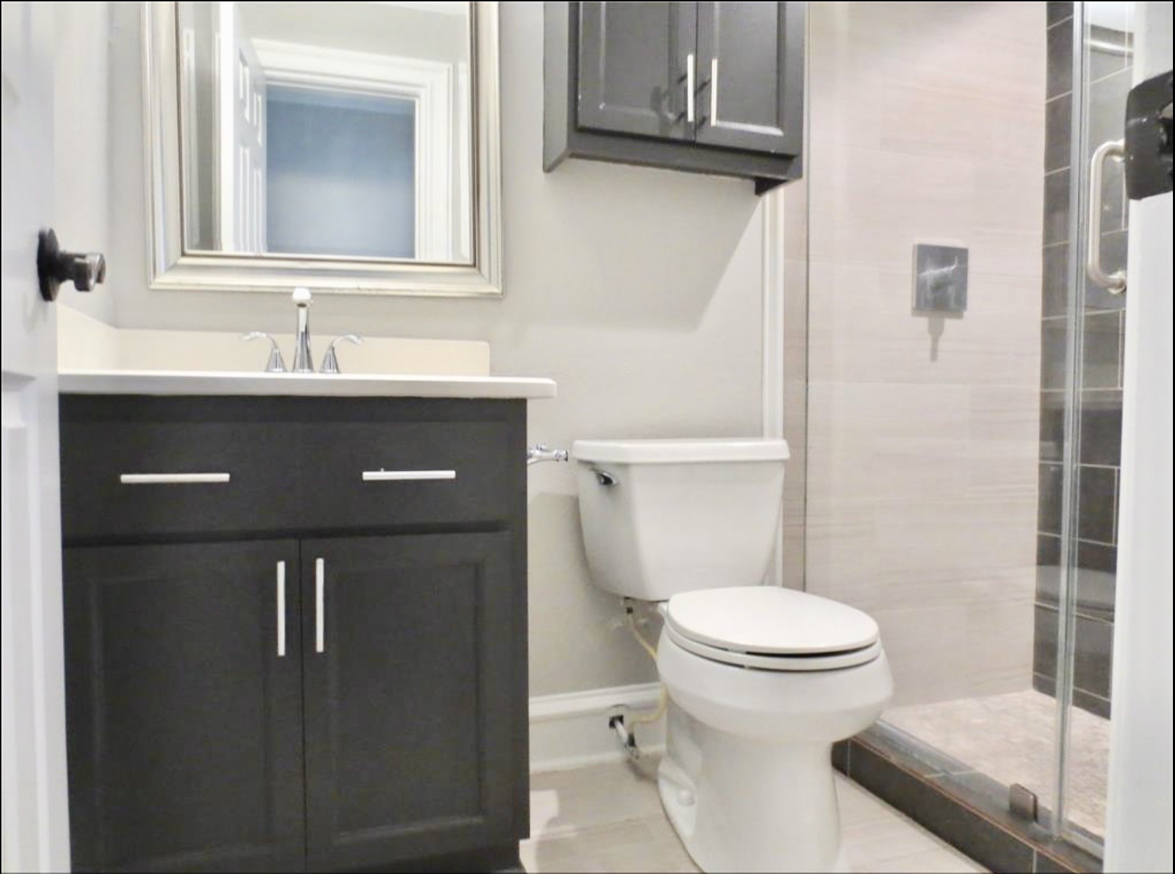 8214 Split Oak Drive Houston, TX 77040 - Photo 10 of 15 a bathroom with a sink a toilet and shower