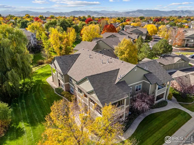 an aerial view of a house with a yard basket ball court and outdoor seating