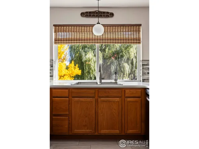 a view of a room with windows and tub