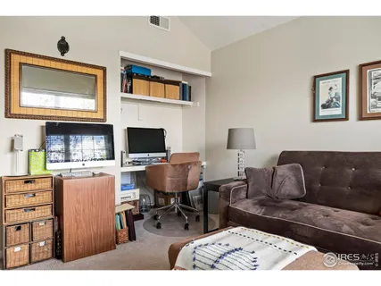 a living room with furniture window and a flat screen tv