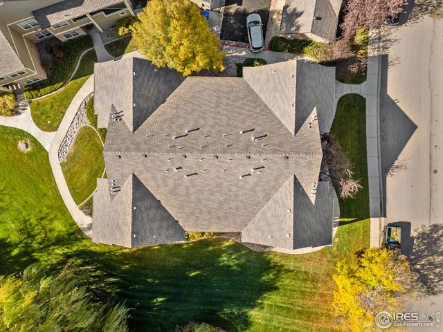an aerial view of a house with a swimming pool