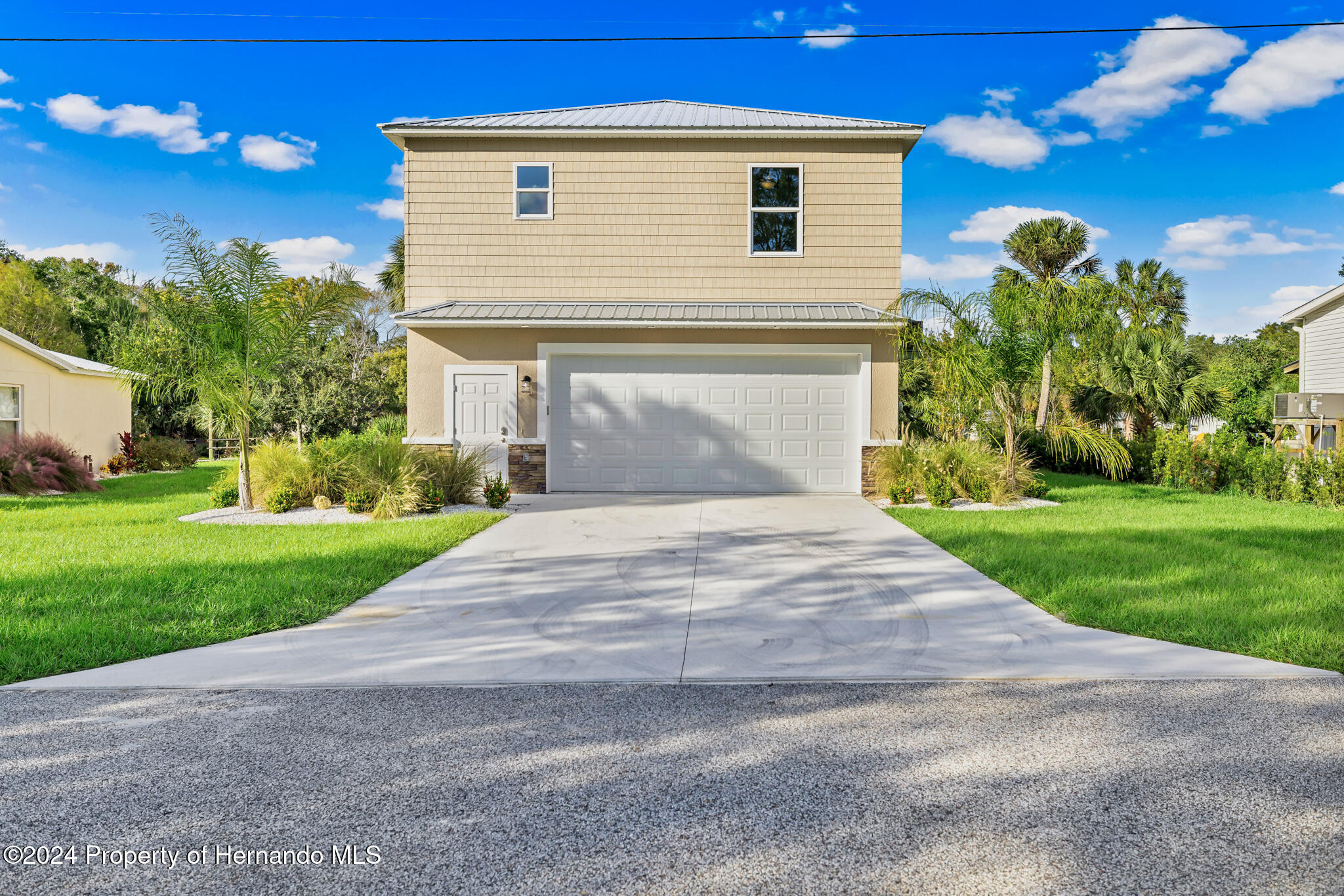 6435 Finance Avenue Weeki Wachee, FL 34607 - Photo 28 of 35 a front view of house with garden