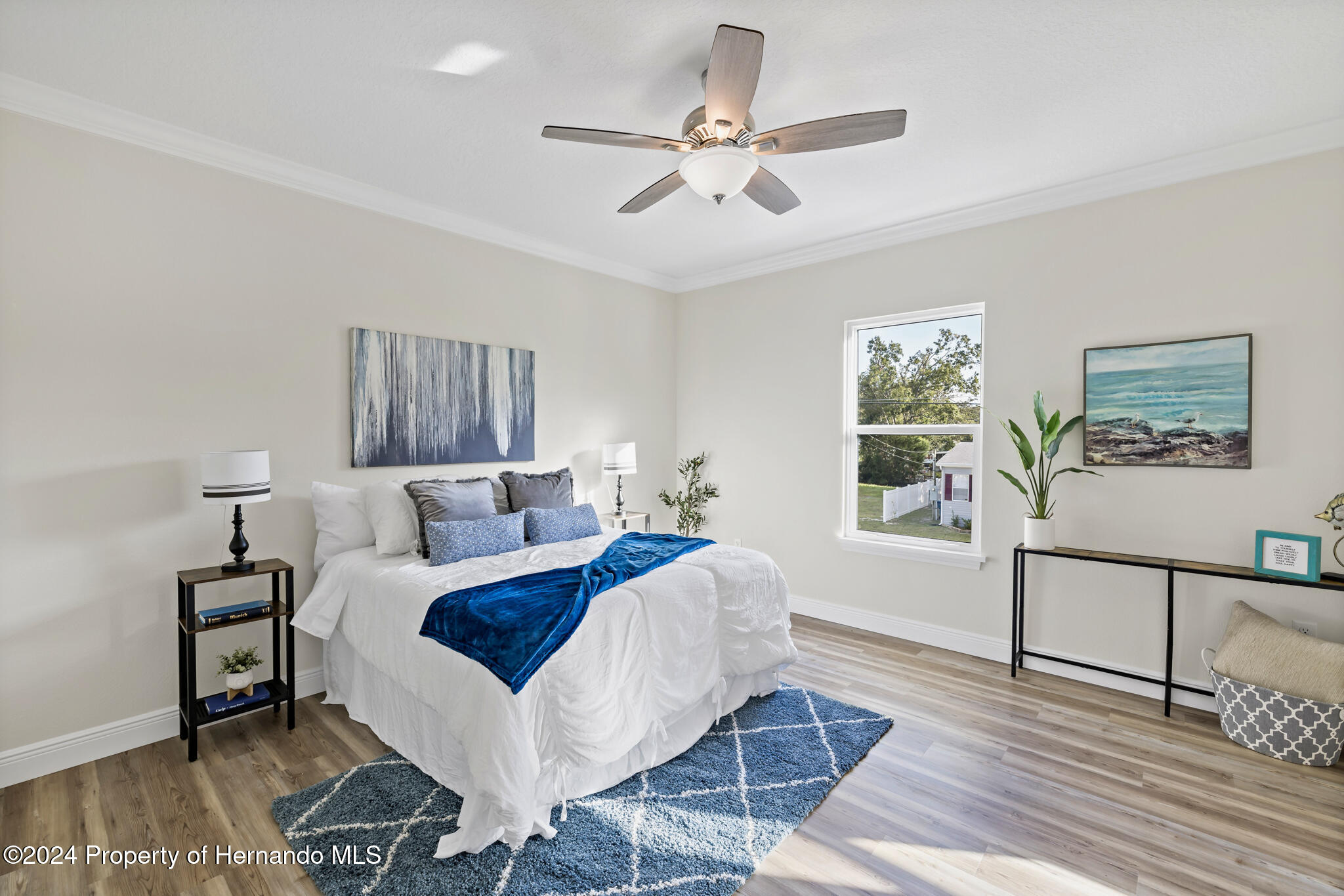 6435 Finance Avenue Weeki Wachee, FL 34607 - Photo 6 of 35 a bed room with a bed and a window