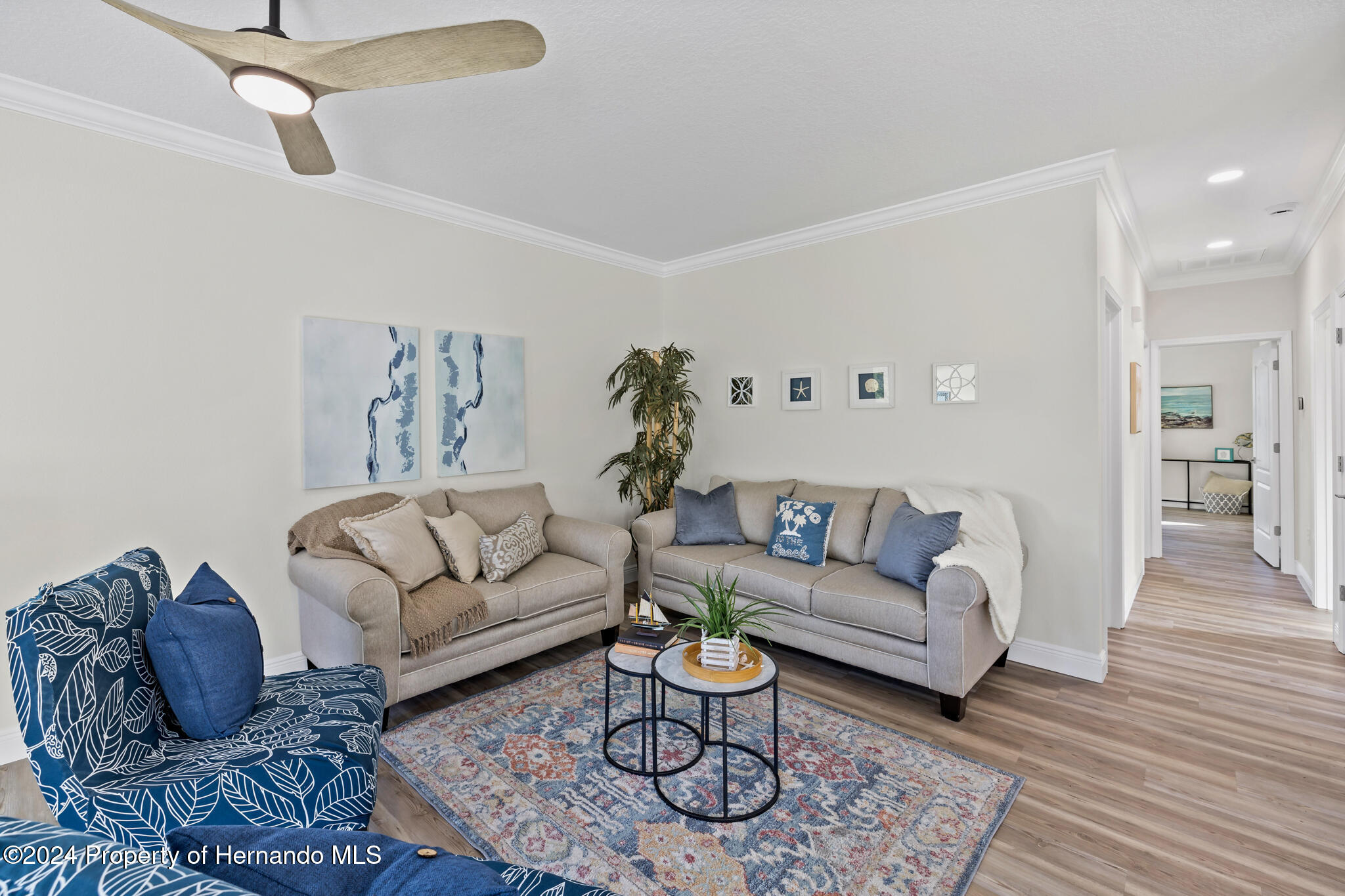 6435 Finance Avenue Weeki Wachee, FL 34607 - Photo 9 of 35 a living room with furniture a rug and a couch
