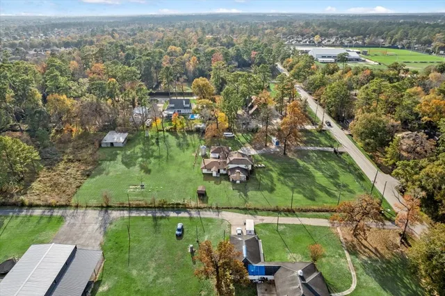 an aerial view of residential houses with outdoor space