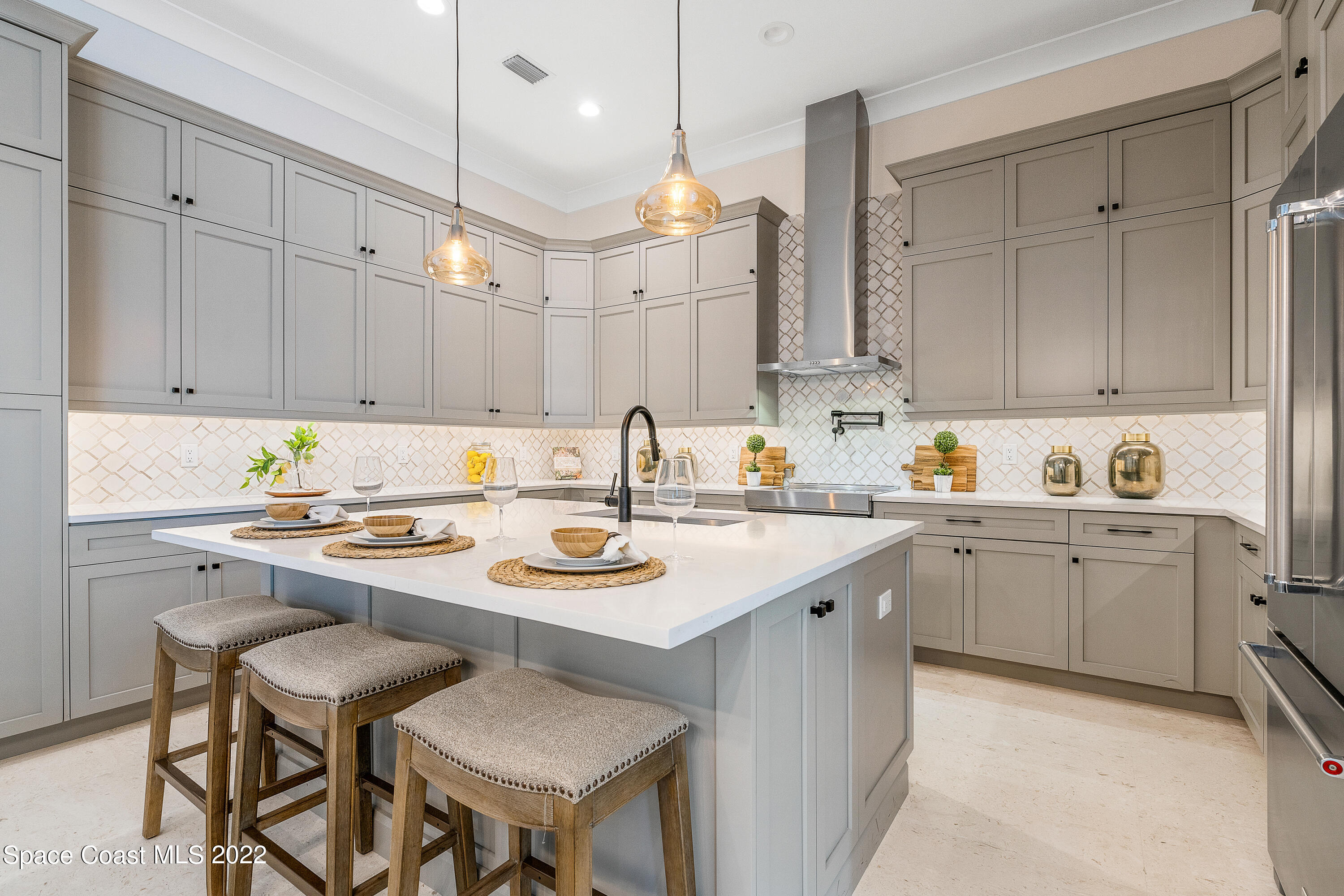 20 Strand Drive Vero Beach, FL 32963 - Photo 12 of 36 a kitchen with a sink window and cabinets