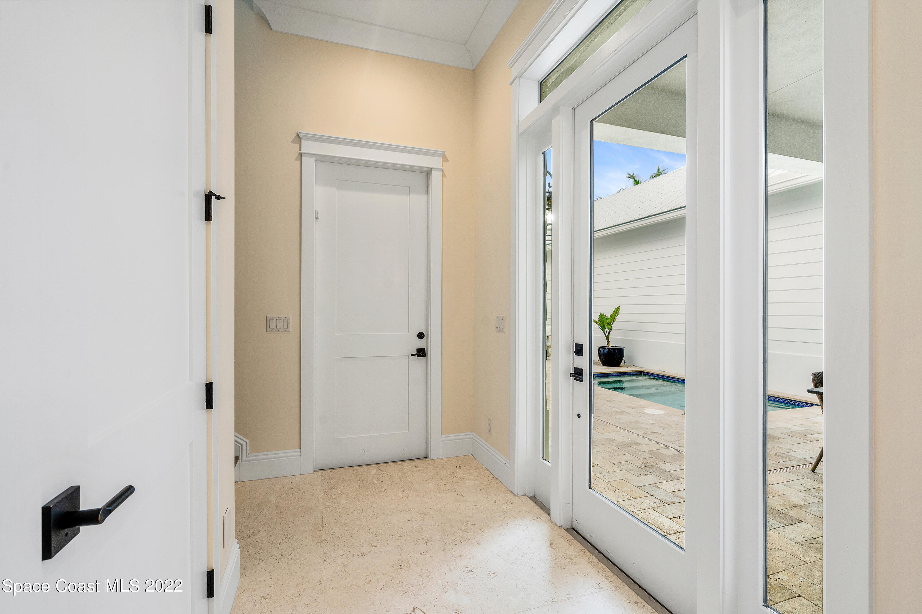 20 Strand Drive Vero Beach, FL 32963 - Photo 16 of 36 a view of a bathroom from a hallway