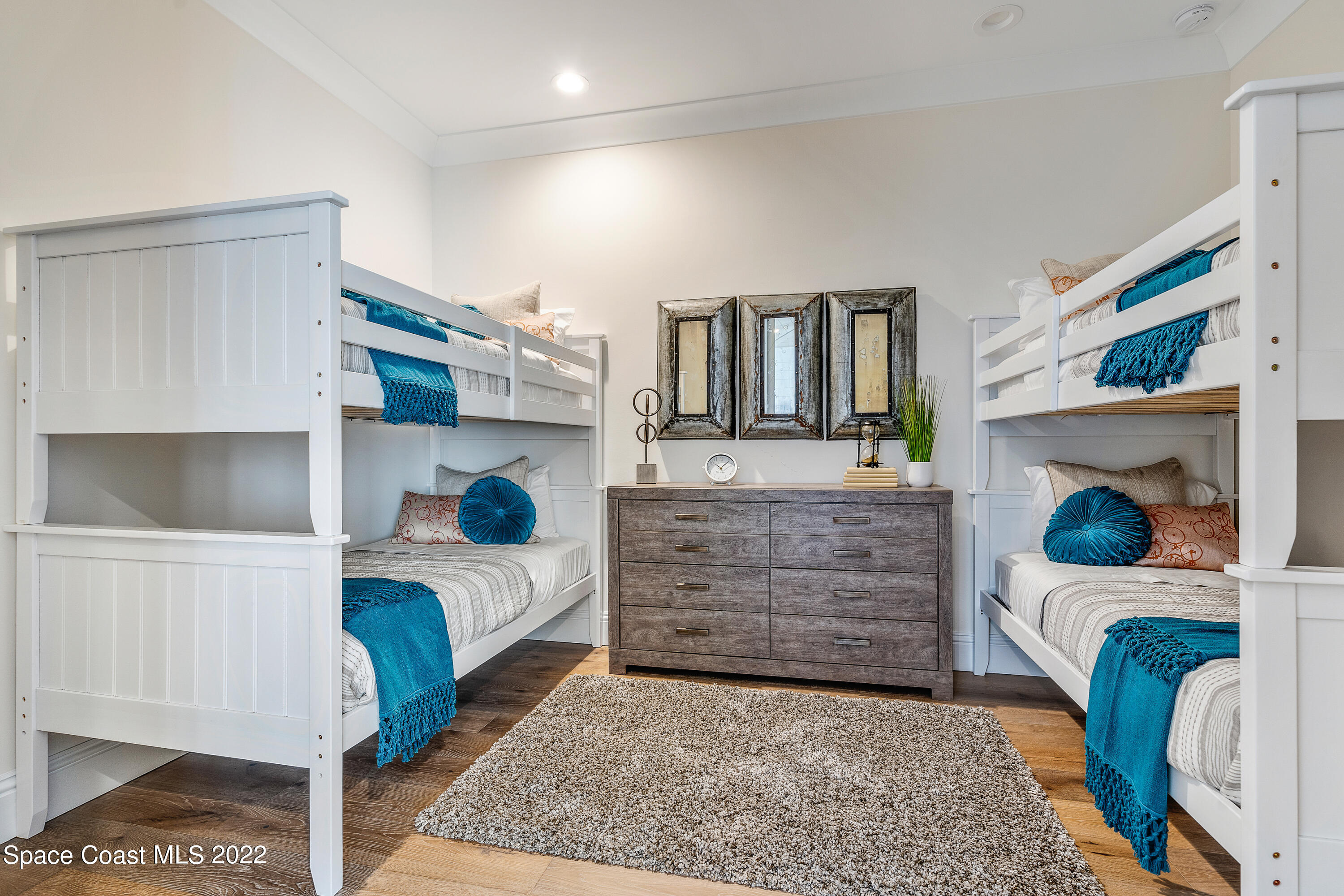 20 Strand Drive Vero Beach, FL 32963 - Photo 26 of 36 a bedroom with a bed and a fireplace