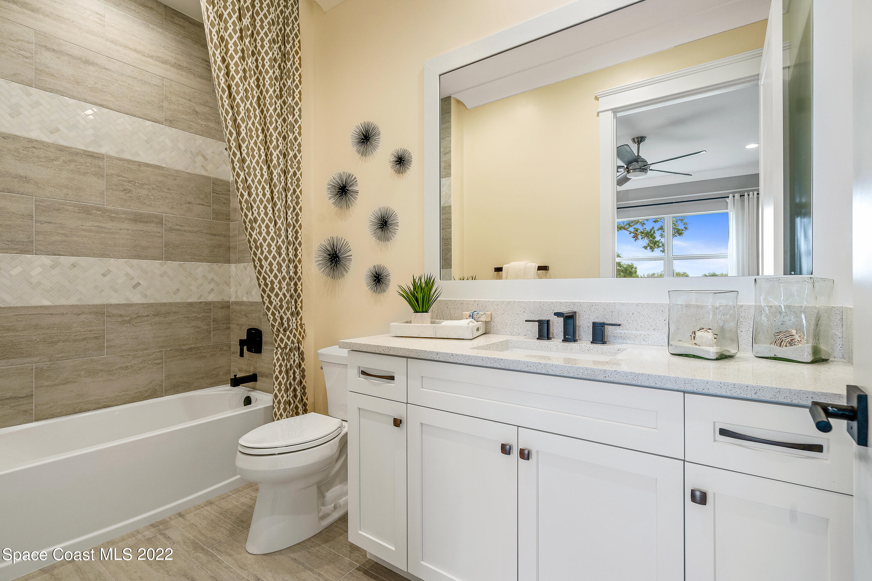20 Strand Drive Vero Beach, FL 32963 - Photo 27 of 36 a bathroom with a sink a toilet and a bathtub