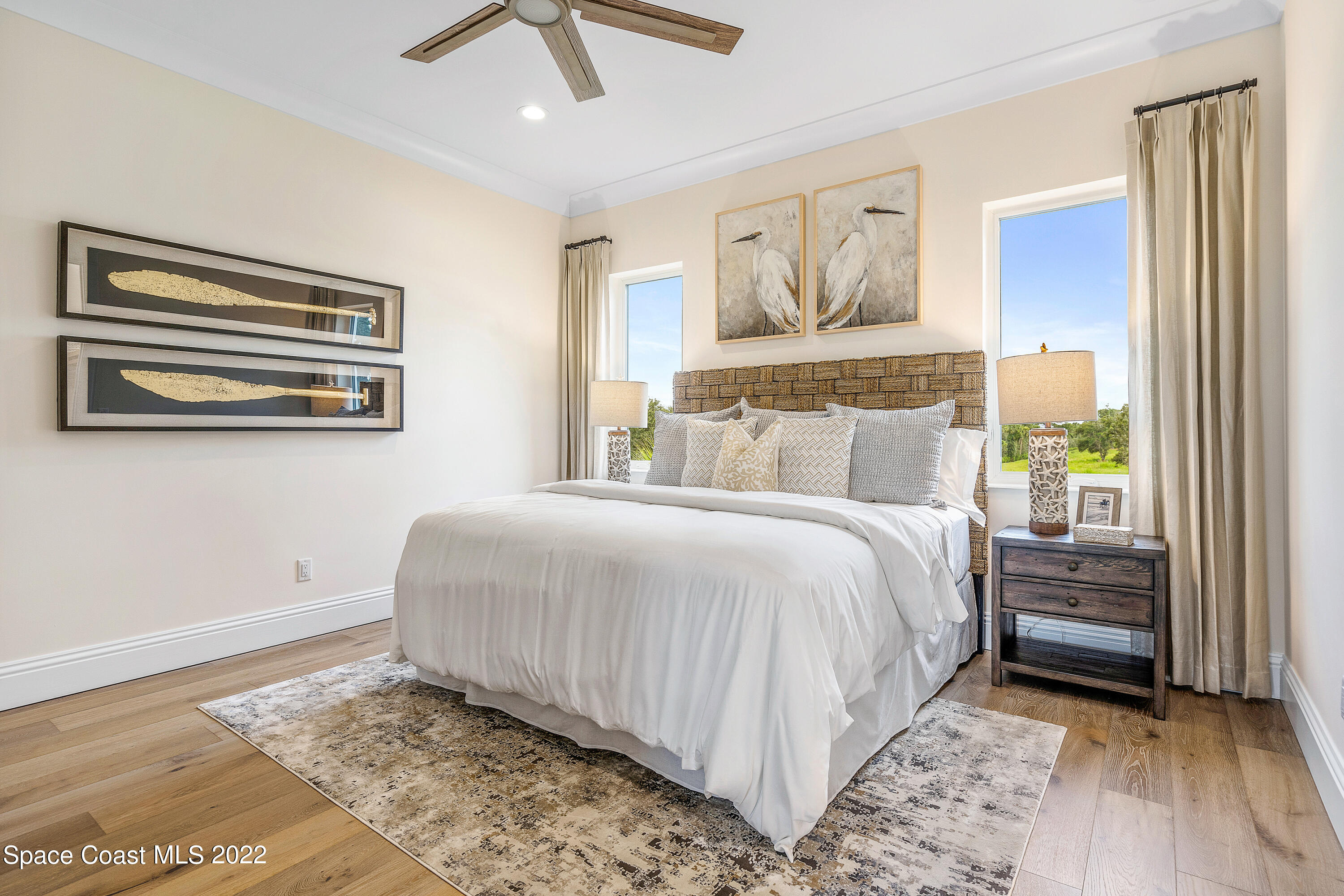 20 Strand Drive Vero Beach, FL 32963 - Photo 30 of 36 a bedroom with a bed and a painting on the wall