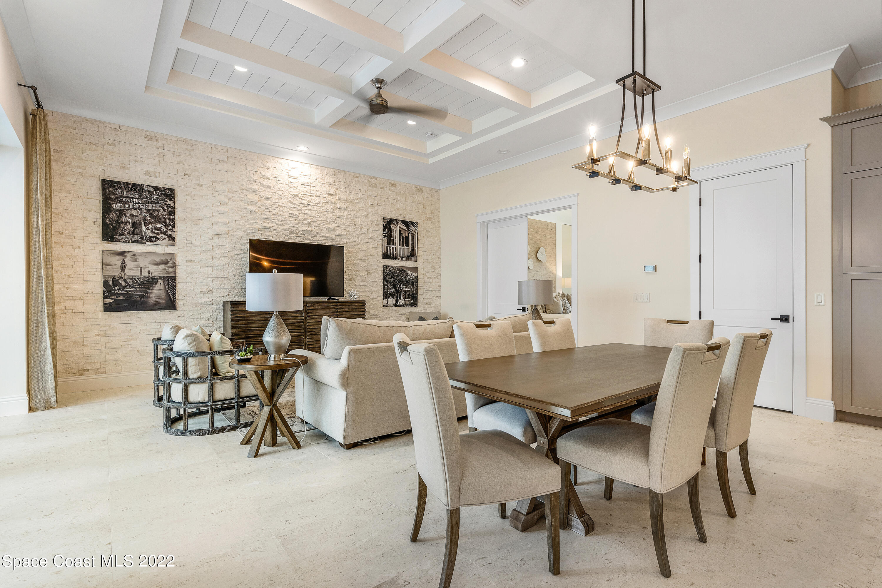 20 Strand Drive Vero Beach, FL 32963 - Photo 8 of 36 a view of a dining room with furniture a chandelier and wooden floor