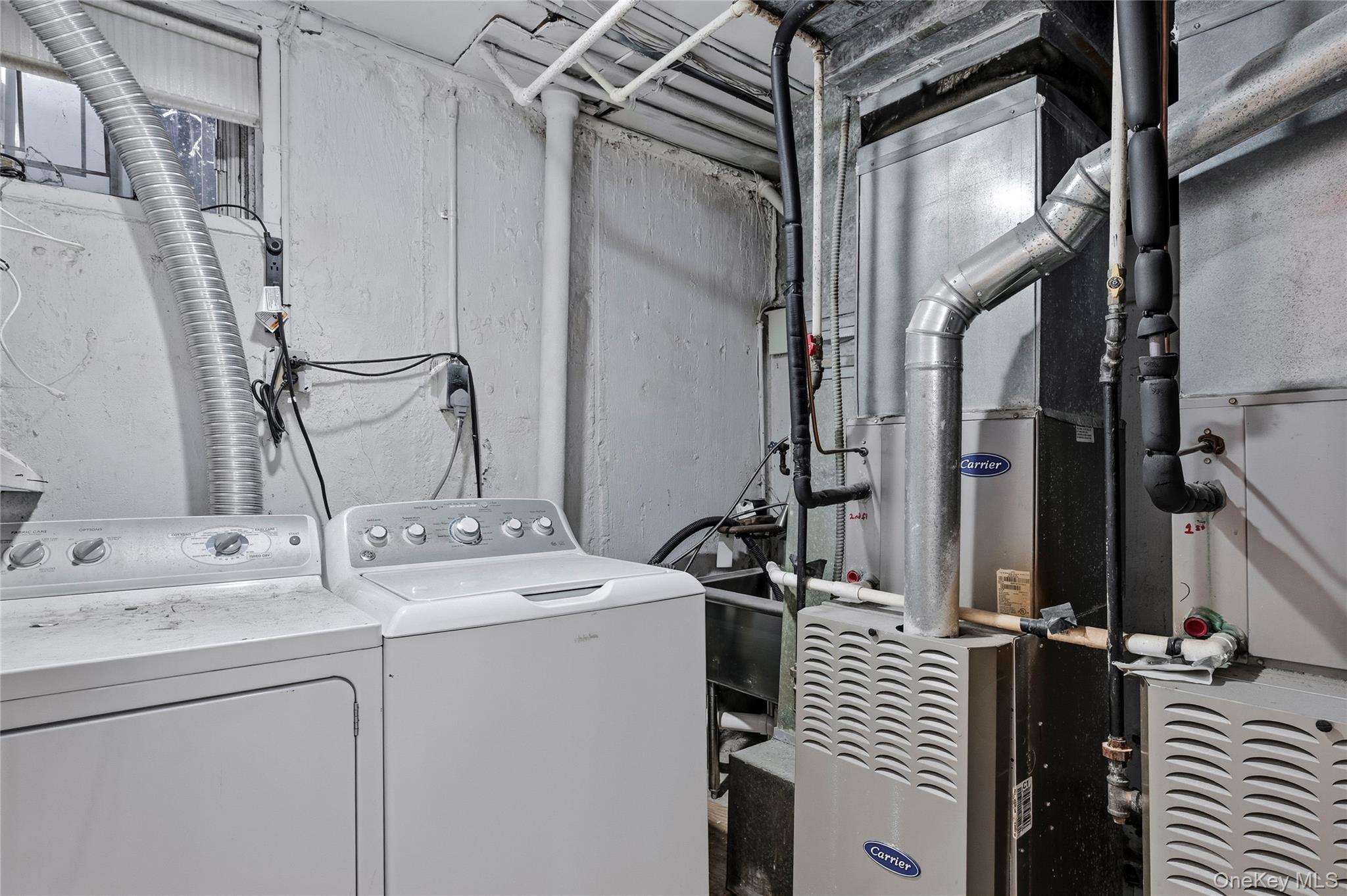 15-69 215th Street, Unit 1 Queens, NY 11360 - Photo 17 of 20 a bathroom with a sink and a mirror