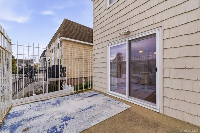 a view of a house with a wooden fence