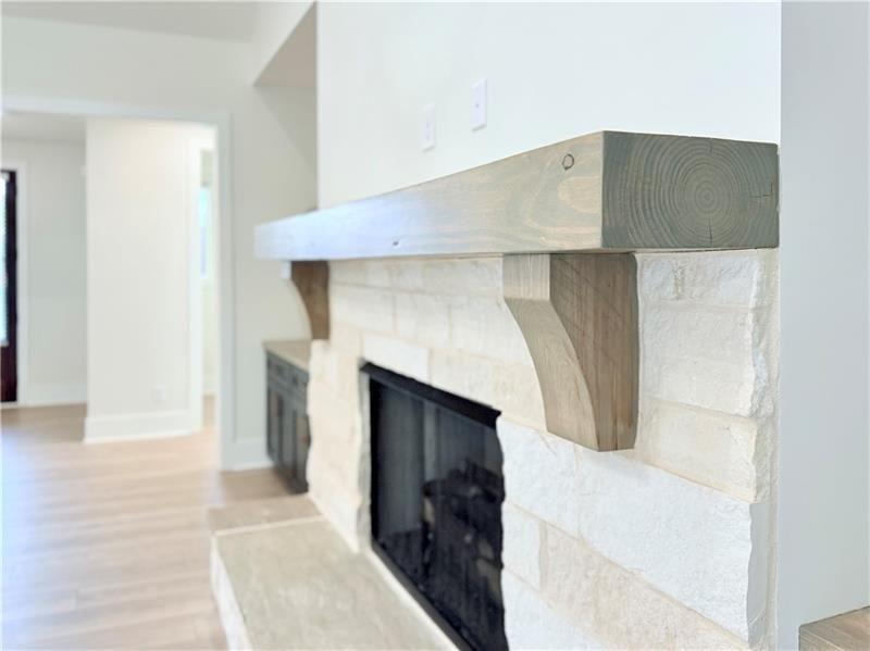 122 Palisade Drive Rydal, GA 30171 - Photo 11 of 54 a living room with a fireplace and a rug